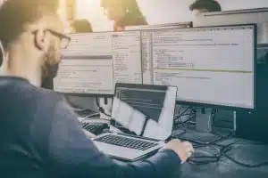 Programmer working on website coding